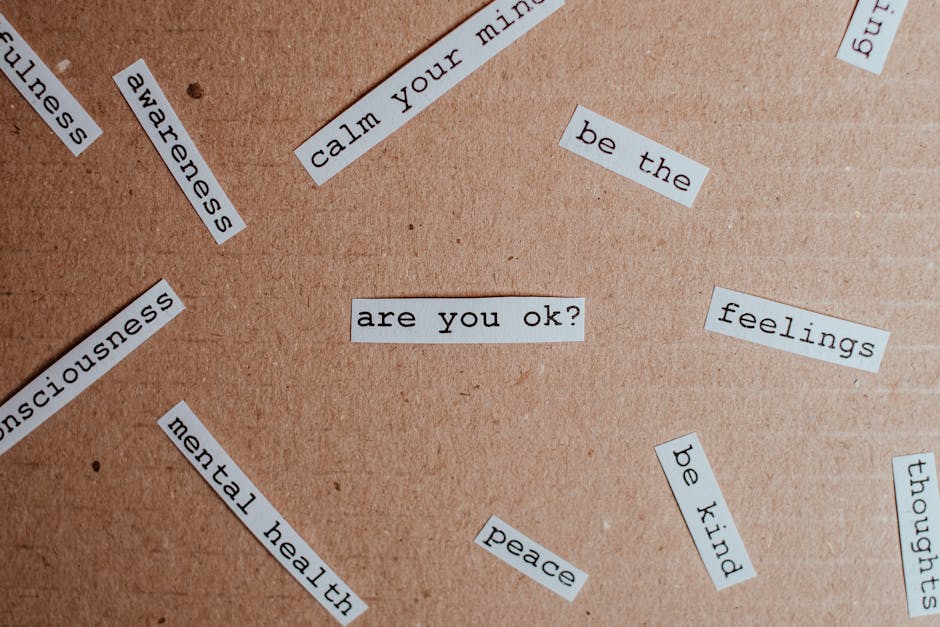 pexels-photo-7004950-7004950 Cut-out words promoting mental health awareness on cardboard background.
